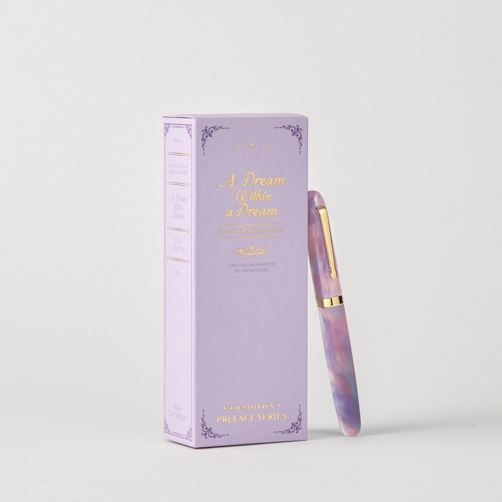 Capped Wearingeul A Dream Within a Dream fountain pen beside its lavender book-style box