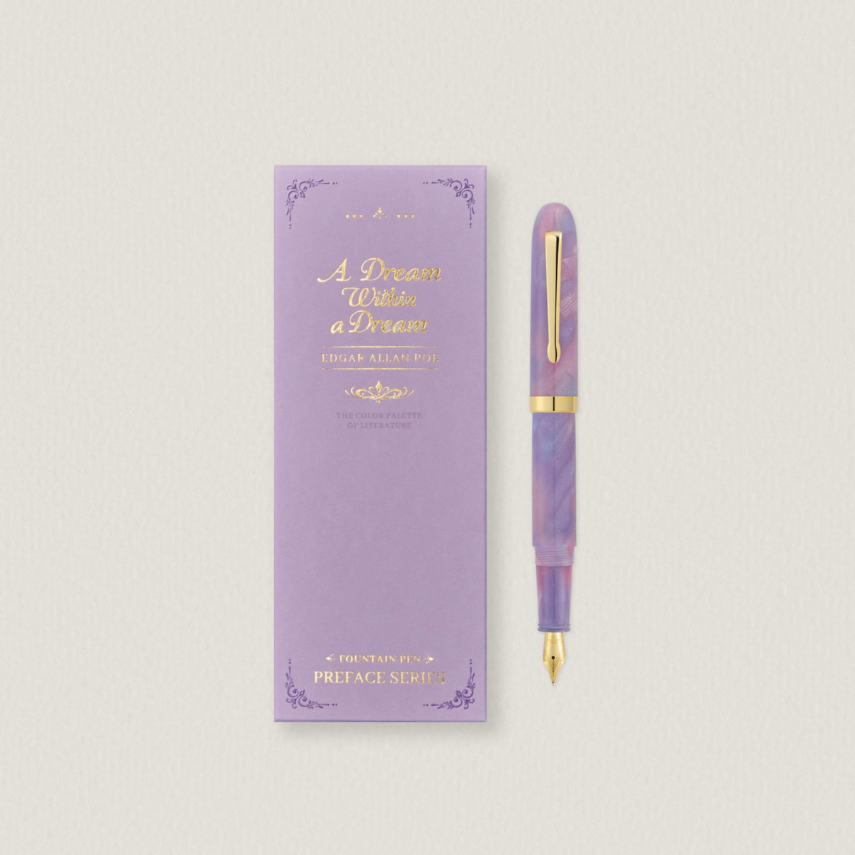 Wearingeul A Dream Within a Dream fountain pen beside its lavender book-style box